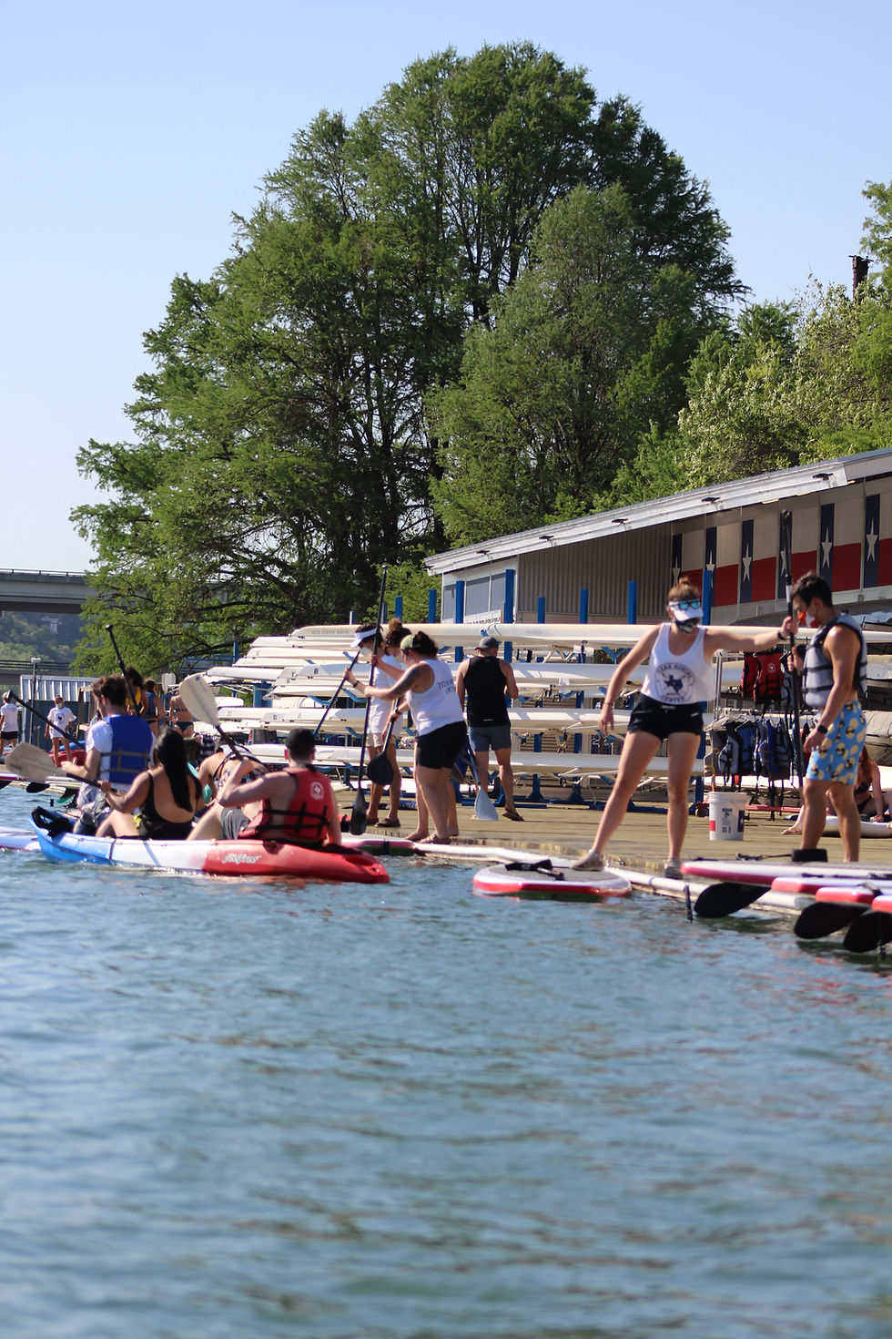 texas rowing center dock with kayaks and paddle boards