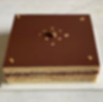 Classic French Opera cake with glossy chocolate glaze, layered cross-section