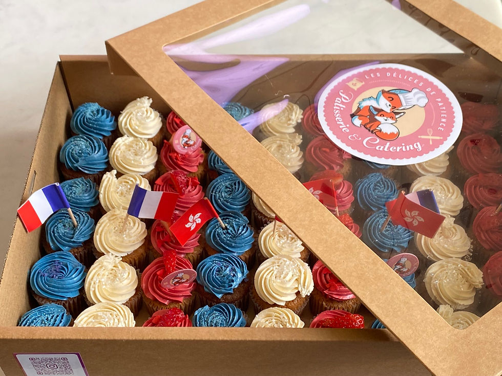 Set of mini cupcakes in a box, blue white and red topping