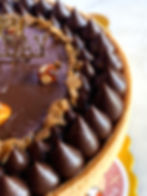 Close-up of hazelnut chocolate tart with ganache swirls – French patisserie in Hong Kong