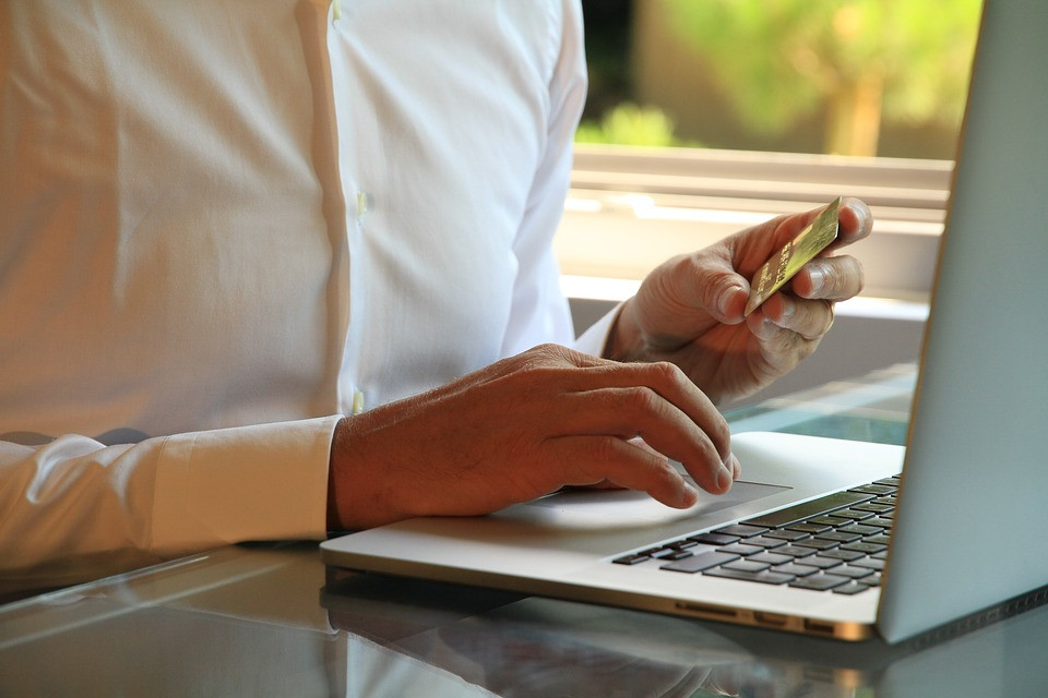 Small business owner setting up cloud software. Digital guide for small business during the pandemic.