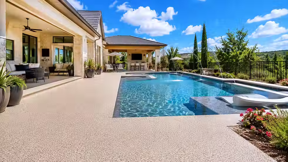 Durable coated pool deck with textured non-slip surface designed for heavy foot traffic and Texas heat.