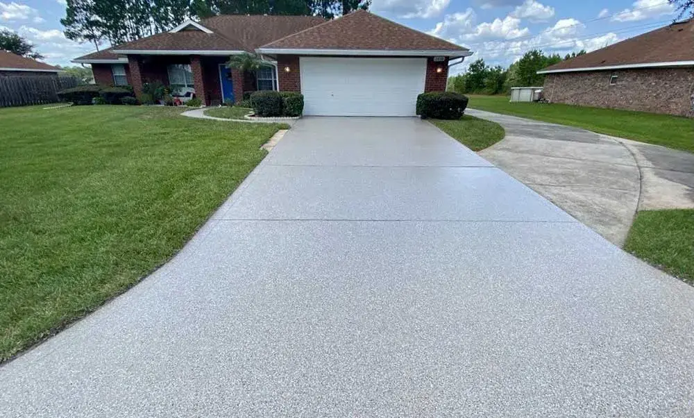 Newly coated driveway, enhancing curb appeal of a house