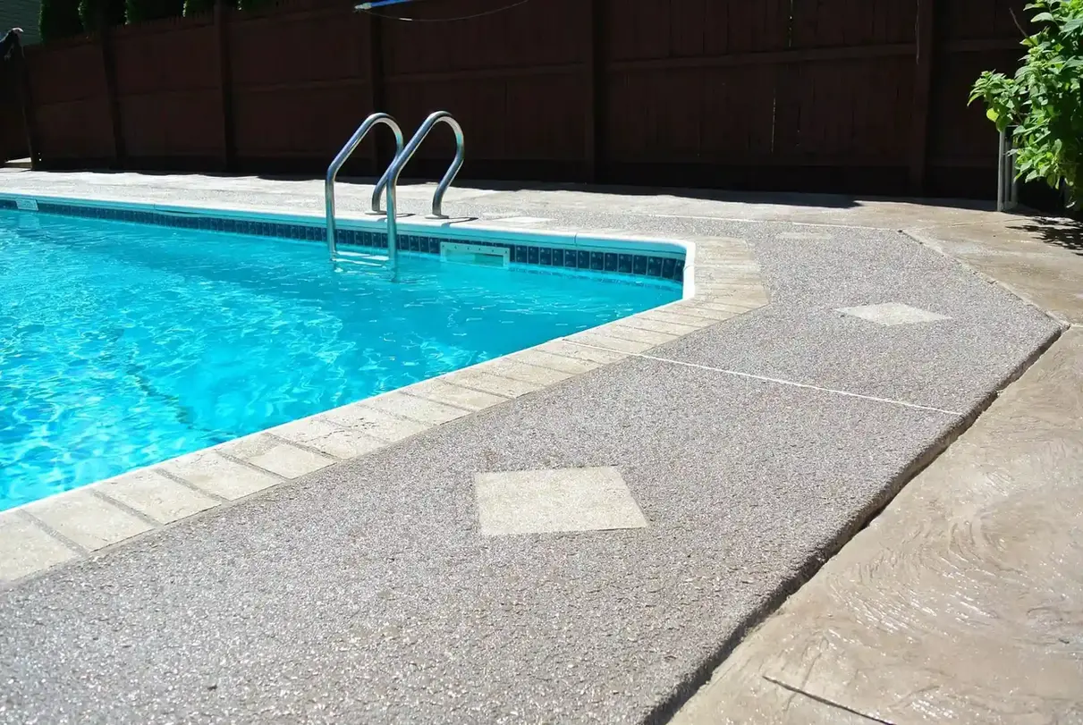 Inviting pool with steps and textured concrete decking