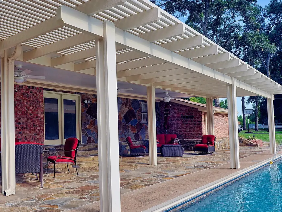 White pergola covers patio with pool view