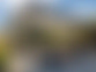 Outdoor furniture protected under a modern pergola with shade canopy