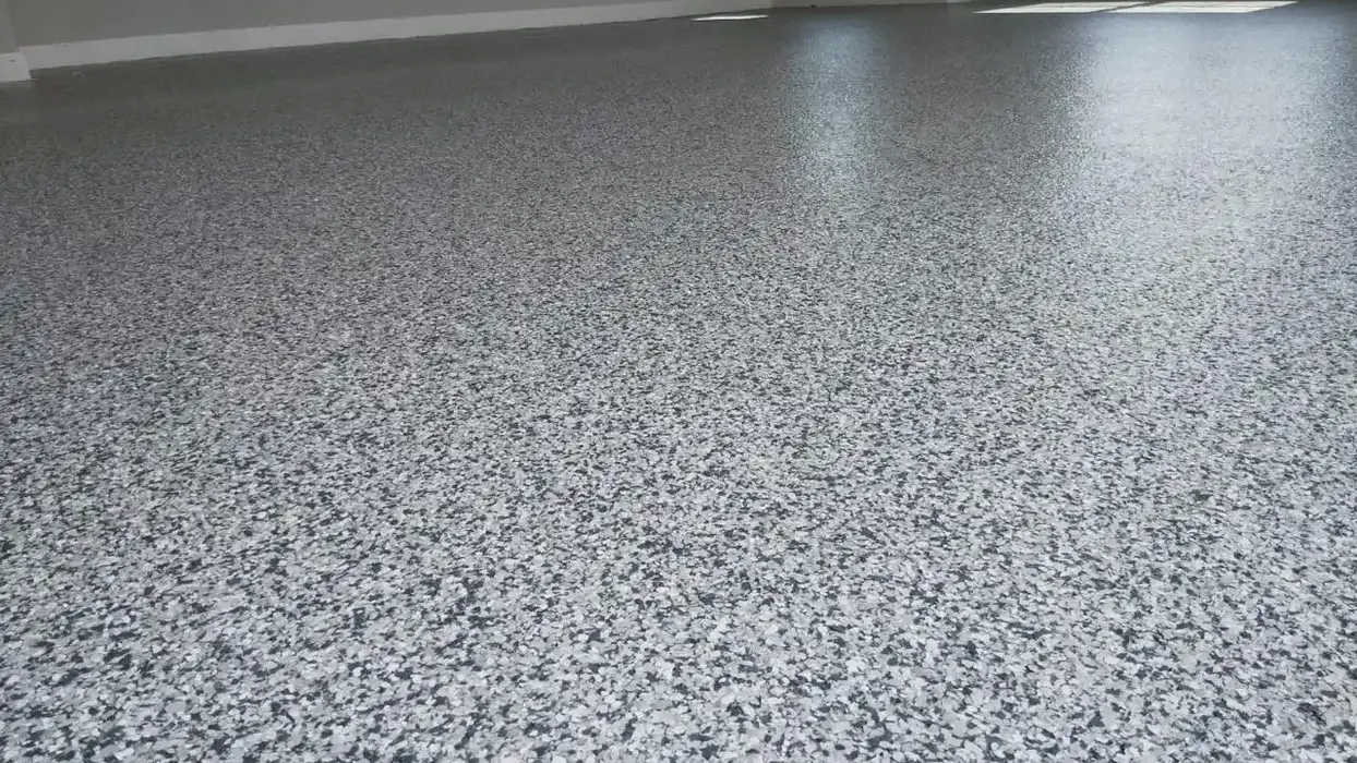New garage floor with speckled, gray epoxy coating