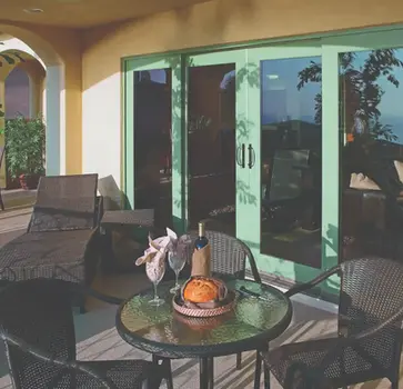 Patio furniture near sliding glass doors