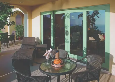 Patio furniture near sliding glass doors