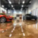 Luxury sports cars showroom with metallic epoxy flooring