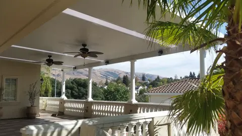 Covered patio with ceiling fans, mountain view