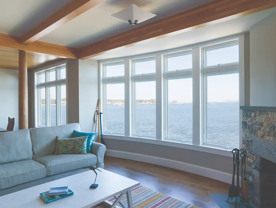 Modern living room with bay windows offering stunning ocean views