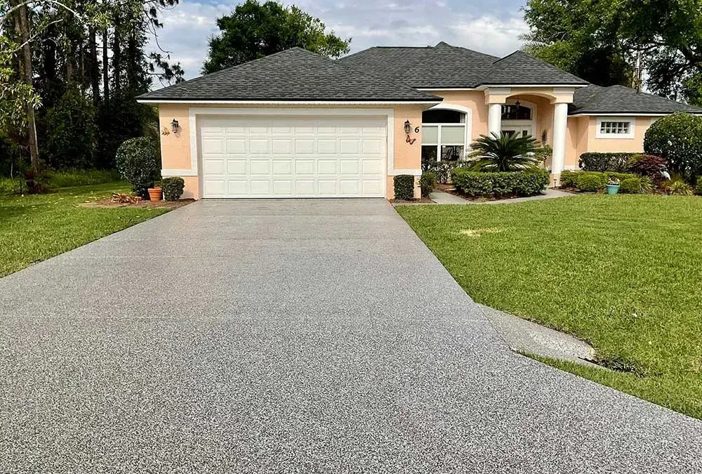 New gray driveway coating enhances curb appeal of house
