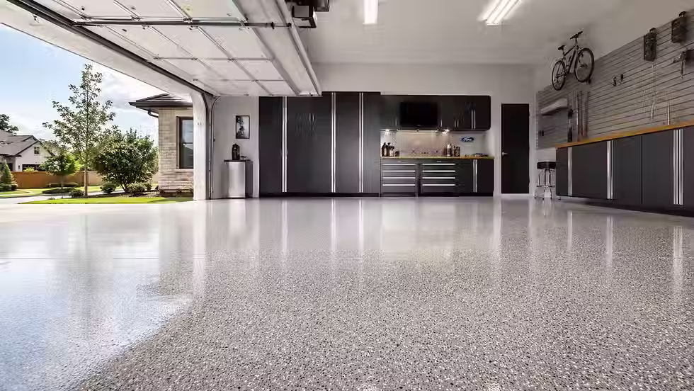 Clean and polished garage floor coating in a modern DFW home improving cleanliness and durability
