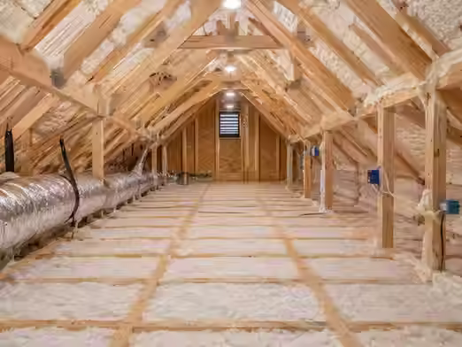 Properly insulated attic showing sealed gaps and clean insulation improving indoor air quality and reducing allergens