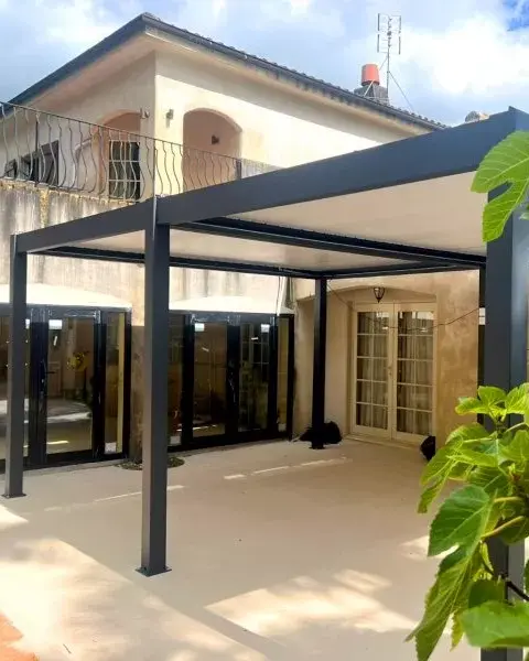 Modern black metal pergola shading patio