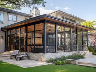Modern sunroom and screen room extensions in a Texas home