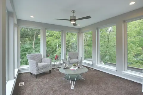 Sunroom with gray chairs and coffee table