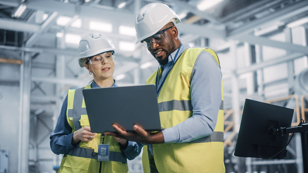 man and woman hardhat laptopo.jpeg