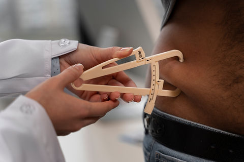 front-view-doctor-using-adipometer.jpg