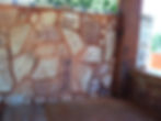 Random stone backsplash on outdorr kitchen