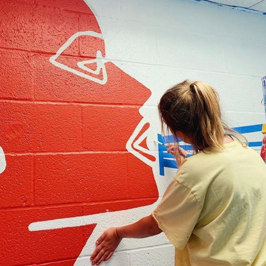 "empowered girls empower each other" mural by lila hathaway