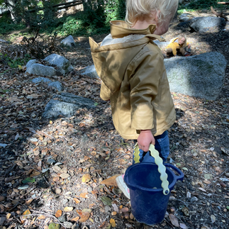 girl walking with bucket
