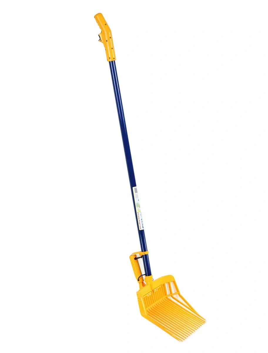 Motorized manure fork sifting clean shavings; tines vibrating, handle steady.