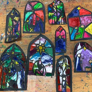 student work of stained glass nativity and candle scenes