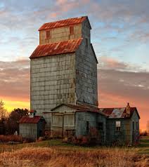 elevator barn with sunset sky behind