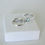 Thumbnail: Blue topaz solitaire ring and wedding band