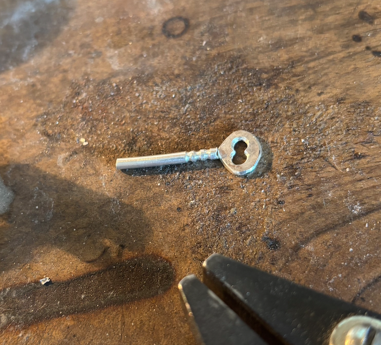 Thumbnail: Silver key, pendant on necklace