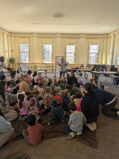 The children of JNP gather together to celebrate Palm Sunday.