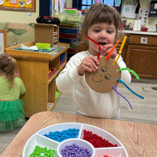 Toddler child lacing beads