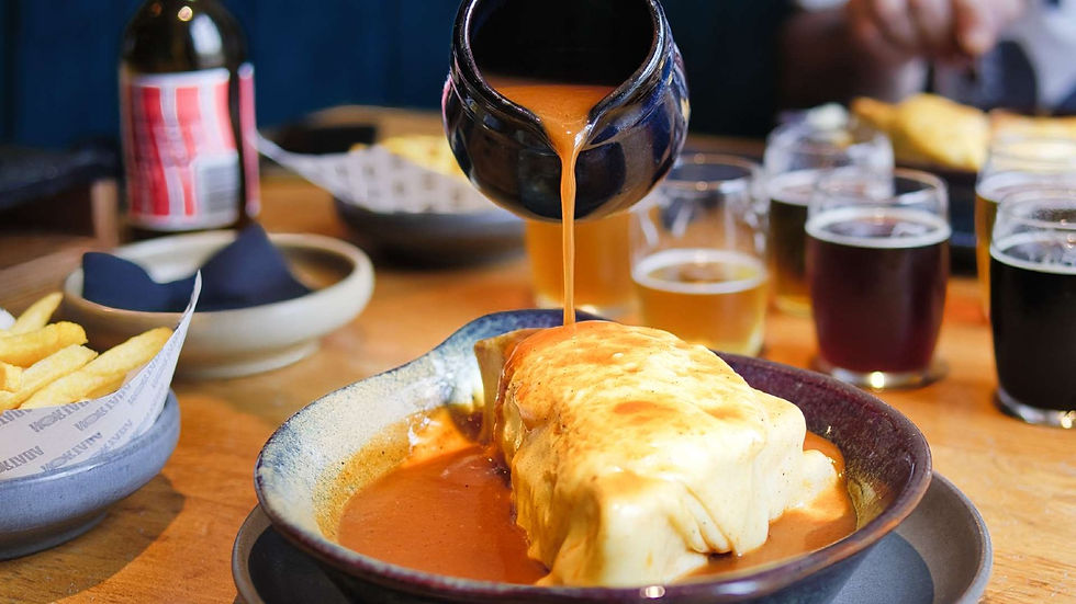 Francesinha with sauce, a traditional Porto food specialty