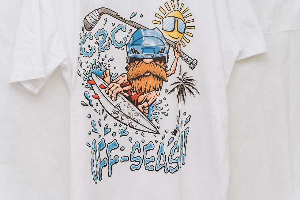 Thumbnail: Off season Ice hockey t-shirt model is Ben Bowns walking on the beach In Barry Island
