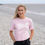 Thumbnail: Baby pink Coast 2 coast reflection t=shirt on Barry island pebble