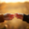 two hands reaching almost touching affac