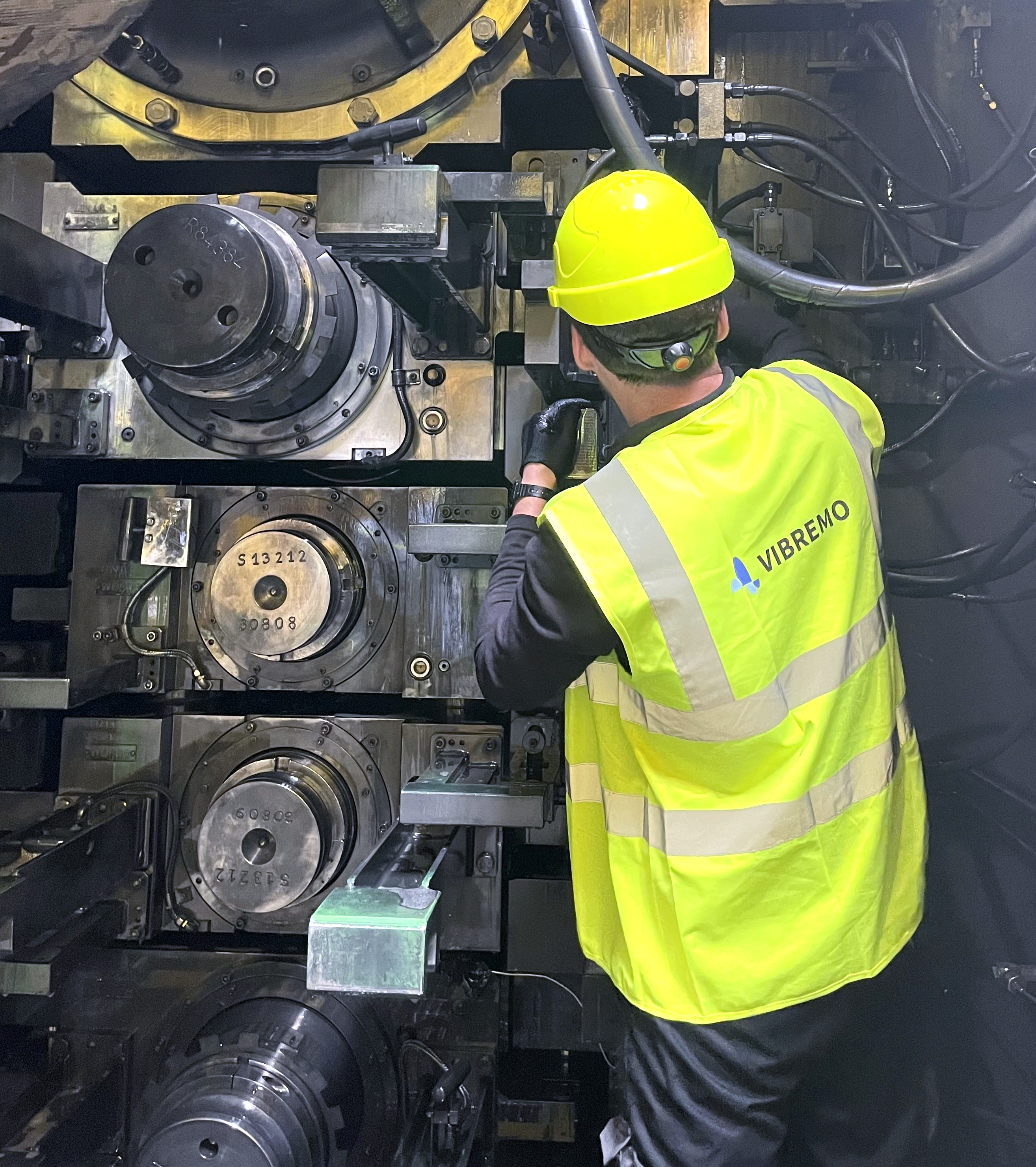Vibremo engineer placing sensor on rolling mill