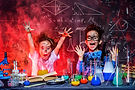 Funny little children doing experiments in the laboratory. Explosion in the laboratory. Sc