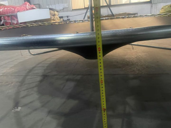 Measuring trampoline mat deflection under load during static load testing