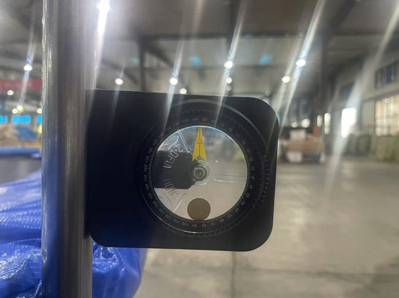A gauge measuring enclosure pole deformation during a trampoline net impact test
