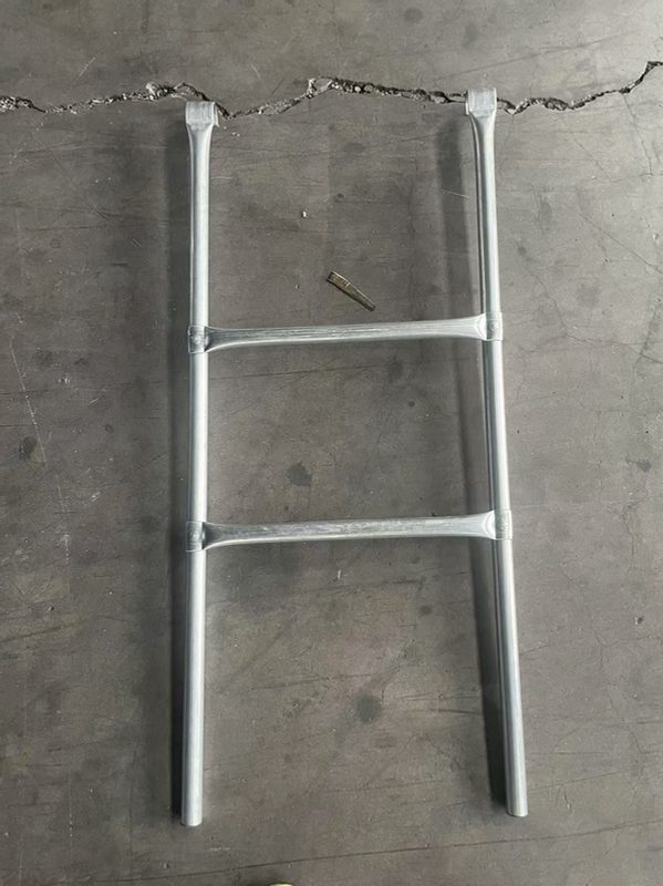 A trampoline ladder inspected for the ASTM-required ladder warning label