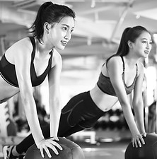 Two clients training together during a 2-1 personal training session