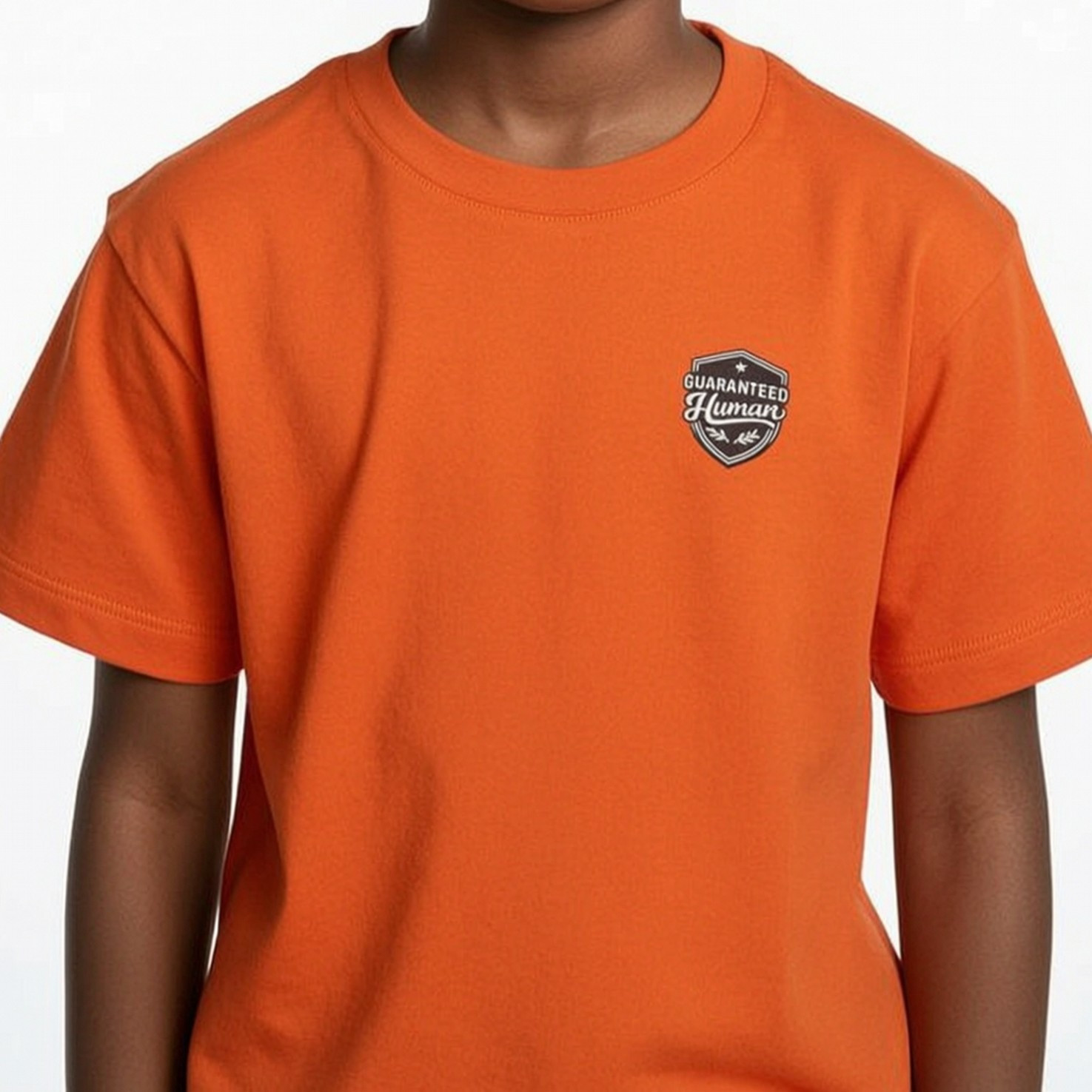 Guaranteed Human™- Youth Crest Heavy Cotton Tee