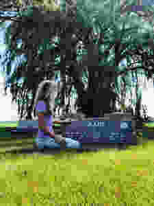 Shauna Gilsdorf visiting her grandparents at the cemetery