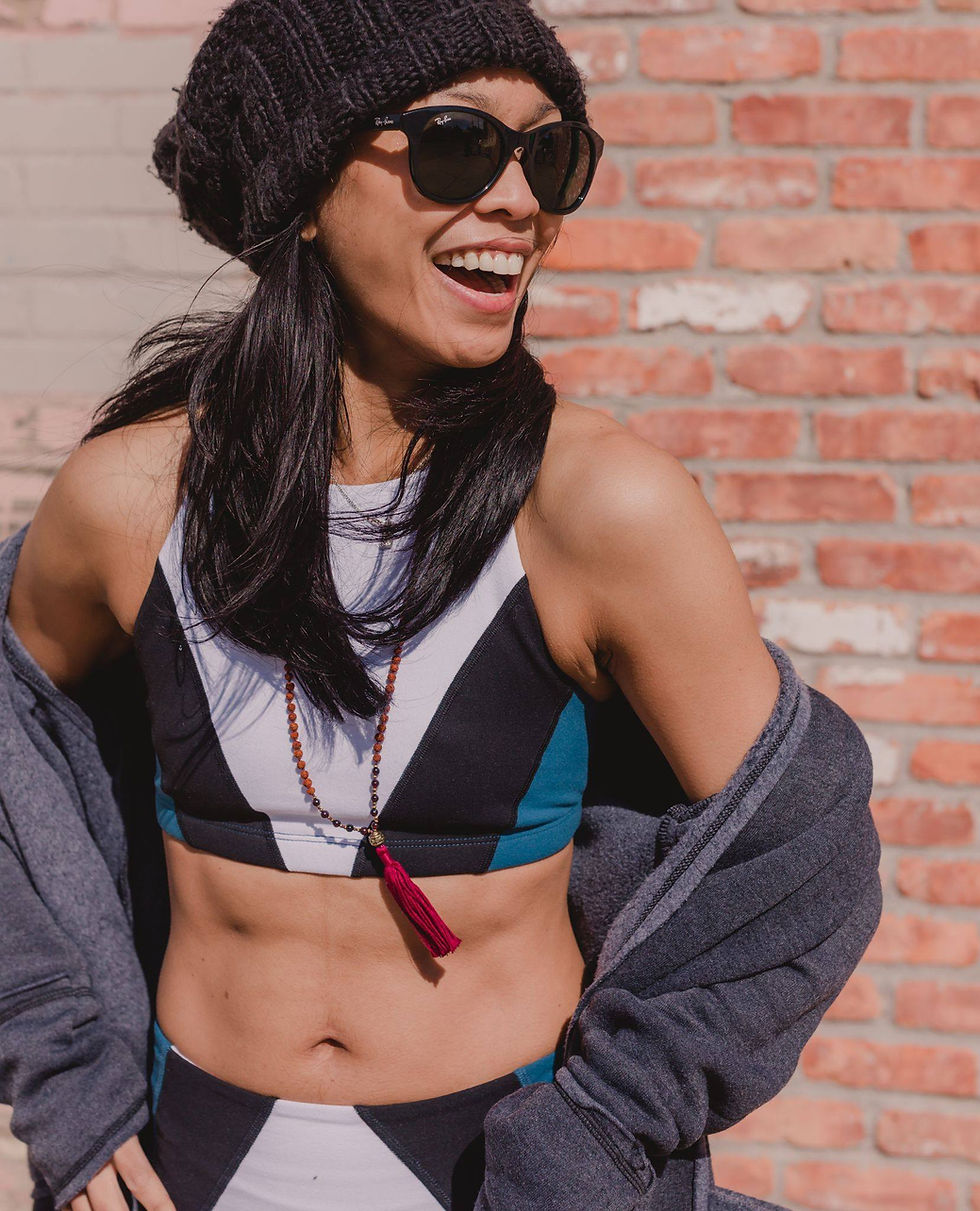Dhawi Pienta laughing in Yogaja Shop clothes by Mary Wyar
