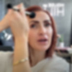Amanda applying a glowy skin makeup look for mature skin