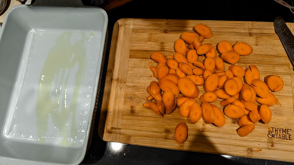 sliced carrots about to be roasted in olive oil
