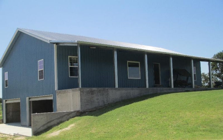 Image shows a blue with white trim barndominium, built on a concrete knee wall, with two garage openings underneath. This is a great solution for this needing creativity in design and construction. 

Cold-formed steel is the best choice when creativity is necessary for the build. 

At HERO STEEL USA we are ready to work alongside you to design the perfect building to match your needs.

We understand that every building is different and requires special attention. We are well-equipped to provide you with the expert advice you deserve. 

At HERO STEEL USA we can make your vision a reality. Contact us for a FREE design consultation.

Call: 727-777-HERO